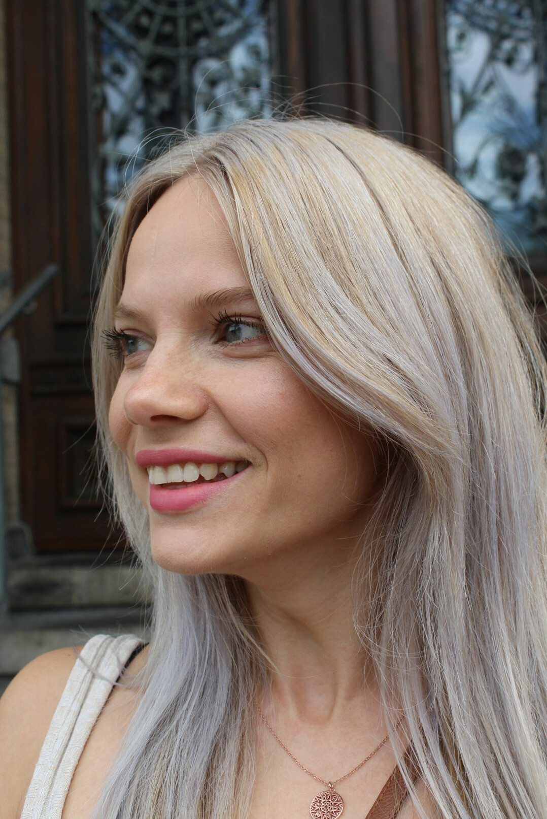 Portrait of a woman with light hair smiling