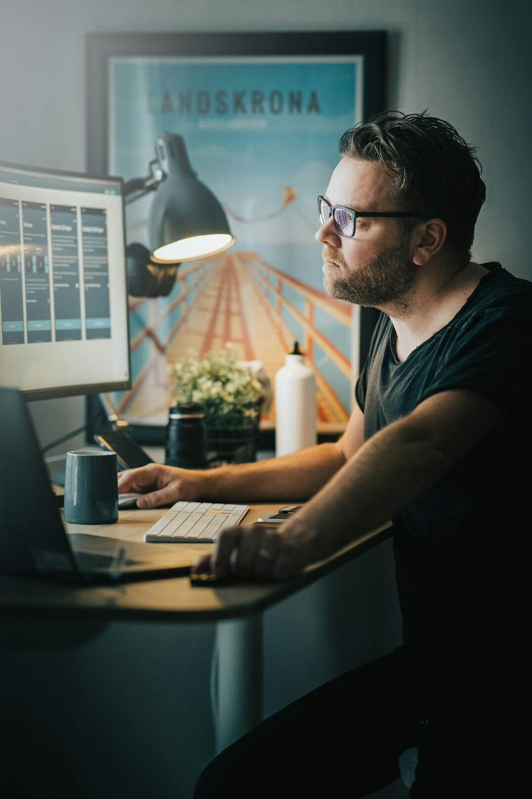 man coding at desk
