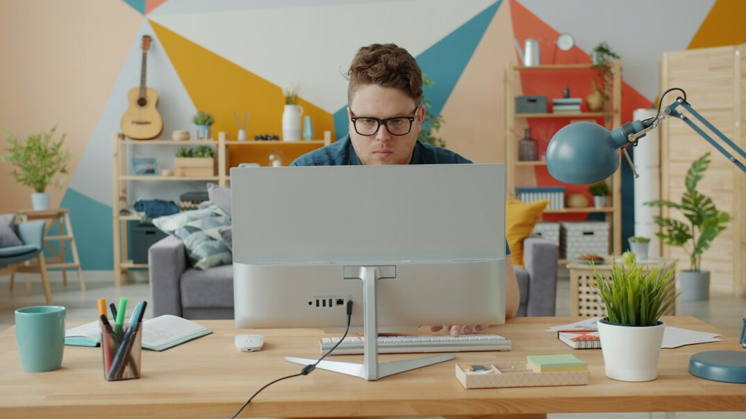professional programmer coding at desk